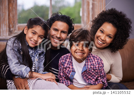 Parents, children and portrait at family in home for bonding connection on weekend, holiday or apartment. Mother, father and siblings with face in living room for happy care together, love or calm Parents, children and portrait at family in home for bonding connection on weekend, holiday or apartment. Mother, father and siblings with face in living room for happy care together, love or calm 141105532