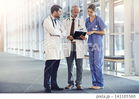 Doctors, expert and team in hospital with notes for diagnosis, discussion and health for medic and treatment. Young people or colleague with stethoscope for healthcare, medical and medicine on mockup 141105560