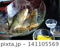 full recipe Complete process of cooking crispy fried crucian carp from cleaning and seasoning to golden frying in nonstick pan creating traditional homemade fish recipe close up food video 141105569