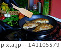 full recipe Complete process of cooking crispy fried crucian carp from cleaning and seasoning to golden frying in nonstick pan creating traditional homemade fish recipe close up food video 141105579