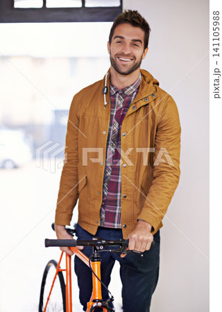 Man, portrait and bike for travel with transportation, carbon footprint and sustainable commute for environment. Bicycle for eco friendly journey, cycling and happy with rider, workout and wellness 141105988