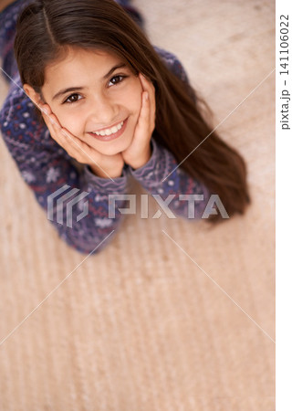 Children, portrait and girl relax on a floor, carpet or relax in her home for vacation, resting or break from above. Top view, face and excited female kid person in a living room for weekend chill Children, portrait and girl relax on a floor, carpet or relax in her home for vacation, resting or break from above. Top view, face and excited female kid person in a living room for weekend chill 141106022