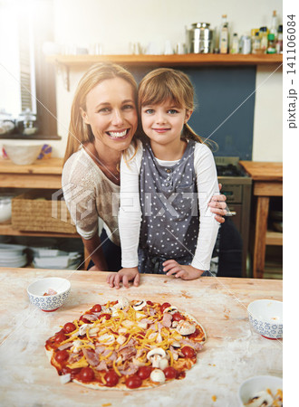 Woman, girl child and cooking pizza with smile in portrait with hug in kitchen for learning, help and development. Food, mother and daughter with dough, teaching and happy for bonding in family home Woman, girl child and cooking pizza with smile in portrait with hug in kitchen for learning, help and development. Food, mother and daughter with dough, teaching and happy for bonding in family home 141106084