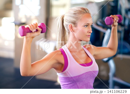 Dumbbells, fitness and woman in gym with arm workout for challenge, health and muscle strength. Weights, exercise and young female athlete with weightlifting training with equipment in sports center. Dumbbells, fitness and woman in gym with arm workout for challenge, health and muscle strength. Weights, exercise and young female athlete with weightlifting training with equipment in sports center. 141106229