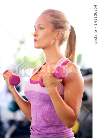 Breathing, fitness and woman with weights in gym with arm workout for wellness, health and muscle strength. Dumbbells, exercise and female athlete with with equipment for training in sports center. Breathing, fitness and woman with weights in gym with arm workout for wellness, health and muscle strength. Dumbbells, exercise and female athlete with with equipment for training in sports center. 141106254