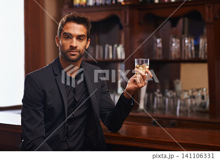 Businessman, portrait or alcohol for break in bar, serious or drink to relax on startup project. Young person, hotel and face for whisky by counter at work and ambition of professional in hospitality Businessman, portrait or alcohol for break in bar, serious or drink to relax on startup project. Young person, hotel and face for whisky by counter at work and ambition of professional in hospitality 141106331