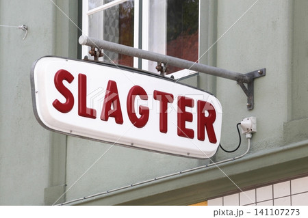Butcher sign on a wall called slagter in Danish language 141107273