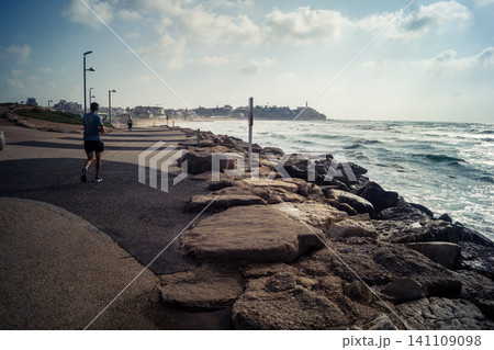 Waves crashing against the rocky coastline with a view of the Mediterranean Sea in Tel Aviv 141109098