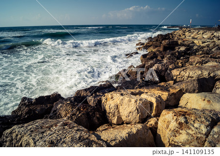 Waves crashing against the rocky coastline with a view of the Mediterranean Sea in Tel Aviv Waves crashing against the rocky coastline with a view of the Mediterranean Sea in Tel Aviv 141109135