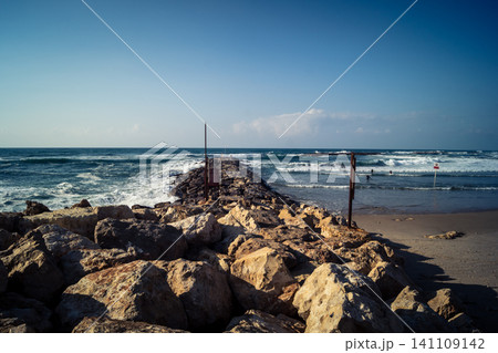 Waves crashing against the rocky coastline with a view of the Mediterranean Sea in Tel Aviv Waves crashing against the rocky coastline with a view of the Mediterranean Sea in Tel Aviv 141109142