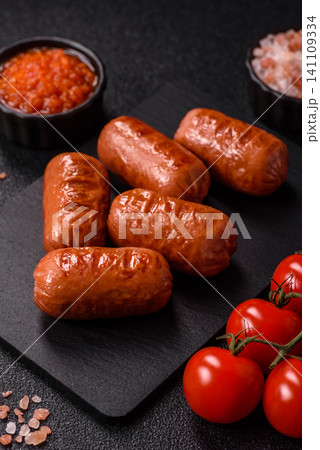 Chicken or pork grilling sausages with garlic, salt, and spices. Grilling sausages Chicken or pork grilling sausages with garlic, salt, and spices. Grilling sausages 141109334