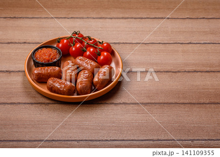 Chicken or pork grilling sausages with garlic, salt, and spices. Grilling sausages Chicken or pork grilling sausages with garlic, salt, and spices. Grilling sausages 141109355