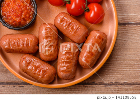 Chicken or pork grilling sausages with garlic, salt, and spices. Grilling sausages 141109358