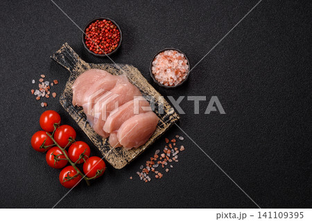 Fresh raw chicken fillet with salt and spices for home cooking. Raw chicken fillet Fresh raw chicken fillet with salt and spices for home cooking. Raw chicken fillet 141109395