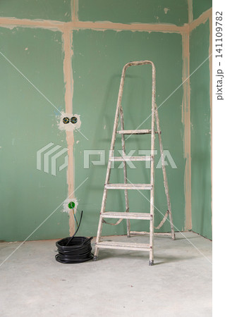 Modern home renovation with electrical outlet preparation background Modern home renovation with electrical outlet preparation background 141109782