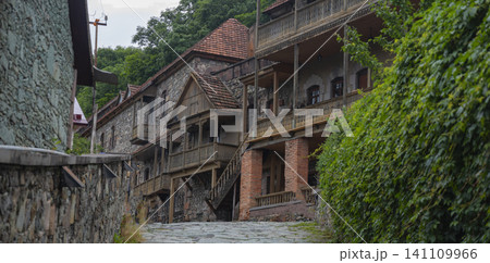 Panoramic Old Dilijan cobblestone street with traditional carved wooden balconies Panoramic Old Dilijan cobblestone street with traditional carved wooden balconies 141109966