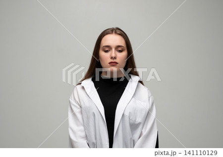 Young woman feeling down, reflecting sadness and despair, experiencing depression and mental health issues, looking away from camera Young woman feeling down, reflecting sadness and despair, experiencing depression and mental health issues, looking away from camera 141110129