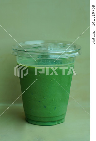 front view matcha green tea in a clear glass on cement wall background, drink, health, fresh, cool, copy space 141110709