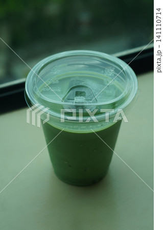 top view ice and fresh matcha green tea in a clear glass on cement wall background, drink, health, fresh, cool, copy space 141110714