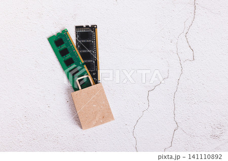 Two computer memory modules in a shopping bag on a light background top view 141110892