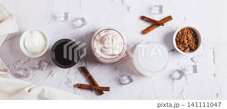 Delicious trendy protein coffee with yogurt in a glass on the table top view web banner 141111047