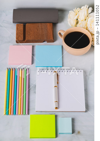 Colorful desk with stationery in trinket design style vertical view Colorful desk with stationery in trinket design style vertical view 141111052