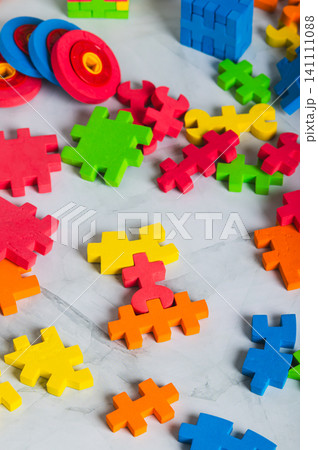 Large pieces of soft, colorful puzzles for educational tabletop play vertical view Large pieces of soft, colorful puzzles for educational tabletop play vertical view 141111088