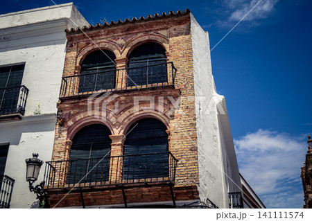 Traditional white-washed narrow streets and historical Andalusian architecture in Carmona Traditional white-washed narrow streets and historical Andalusian architecture in Carmona 141111574