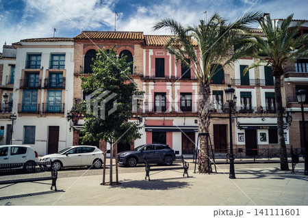 Traditional white-washed narrow streets and historical Andalusian architecture in Carmona Traditional white-washed narrow streets and historical Andalusian architecture in Carmona 141111601