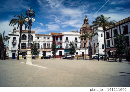 Traditional white-washed narrow streets and historical Andalusian architecture in Carmona Traditional white-washed narrow streets and historical Andalusian architecture in Carmona 141111602