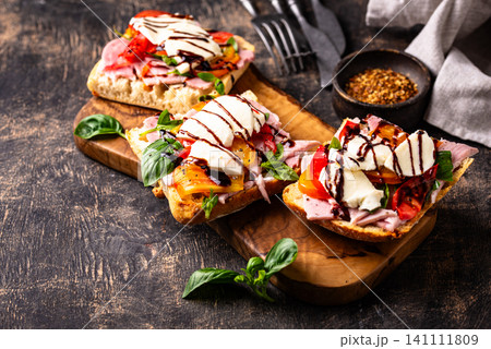 Italian ciabatta with mozzarella and prosciutto Italian ciabatta with mozzarella and prosciutto 141111809