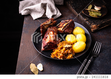 Grilled ribs with sauerkraut and potatoes Grilled ribs with sauerkraut and potatoes 141111818