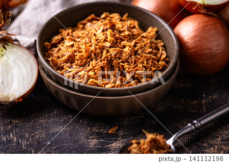 Bowl with chopped fried crispy onions 141112198