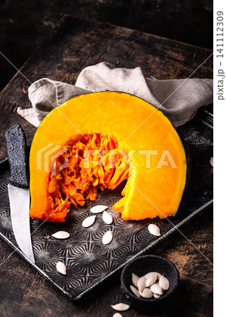 Raw sliced pumpkin with seed Raw sliced pumpkin with seed 141112309