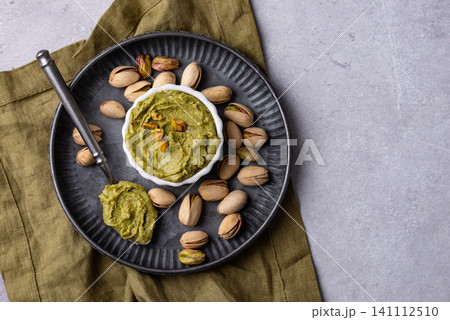 Sweet pistachio cream in a bowl Sweet pistachio cream in a bowl 141112510