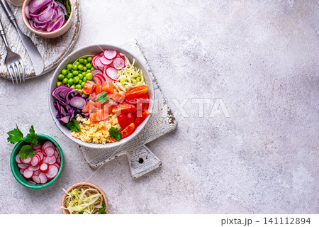 Balanced healthy bowl with vegetables and salmon Balanced healthy bowl with vegetables and salmon 141112894