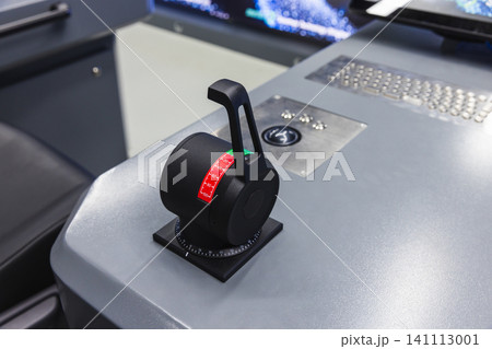 Azimuth thruster control lever mounted on a ship bridge control panel Azimuth thruster control lever mounted on a ship bridge control panel 141113001