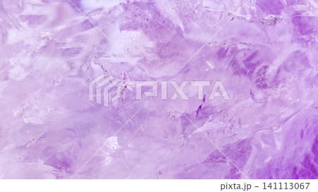 amethyst crystal displays frozen textures with cool Purple hues. The icy surface of the gemstone amethyst crystal displays frozen textures with cool Purple hues. The icy surface of the gemstone 141113067