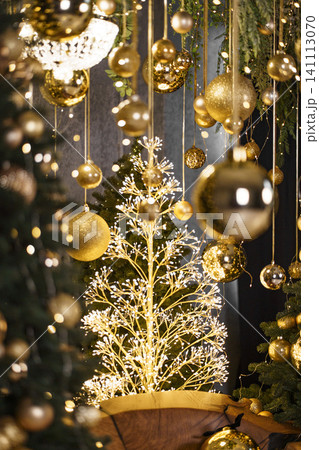 Luxurious Holiday Scene with Golden Baubles and Warm Festive Lighting 141113070