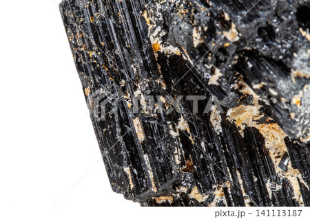 macro mineral stone sherle, schorl, black tourmaline on white background macro mineral stone sherle, schorl, black tourmaline on white background 141113187