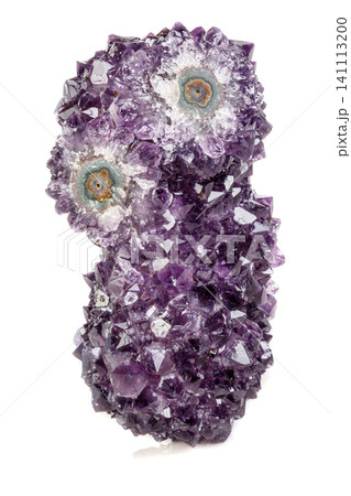 Macro mineral stone Amethyst eye, in the form of an owl on a white background 141113200