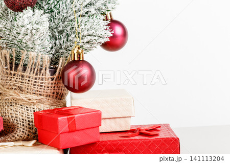 Christmas tree gift boxes with toys on a white background Christmas tree gift boxes with toys on a white background 141113204