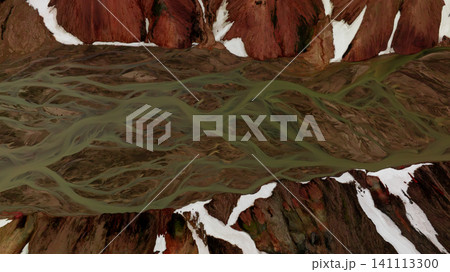 Abstract aerial view of braided glacial river flowing through colorful rhyolite mountains in Iceland's Highlands. Stunning natural patterns created by water, volcanic terrain and melting snow. 141113300