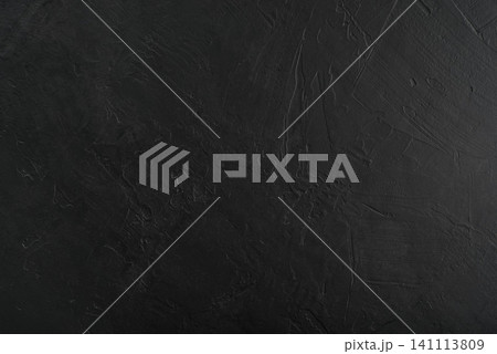 Black textured concrete wall background with trowel strokes. 141113809