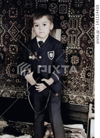 Young Boy Holding a Toy Rifle in Dnipropetrovsk, Ukraine, September 1971 Young Boy Holding a Toy Rifle in Dnipropetrovsk, Ukraine, September 1971 141114488