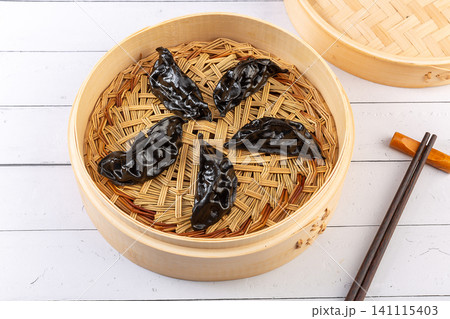 black Cuttlefish Ink Steamed Dumplings in Bamboo Basket, Seafood Dim Sum 141115403