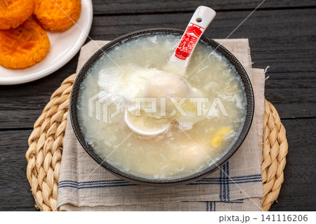 traditional Chinese Egg Noodle Soup in Ceramic Bowl, Rustic Style Asian Comfort Food traditional Chinese Egg Noodle Soup in Ceramic Bowl, Rustic Style Asian Comfort Food 141116206