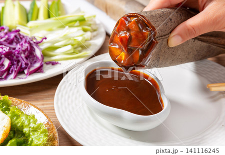black Rice Pancake Rolls with Vegetables and Dipping Sauce, Chinese Street Food black Rice Pancake Rolls with Vegetables and Dipping Sauce, Chinese Street Food 141116245