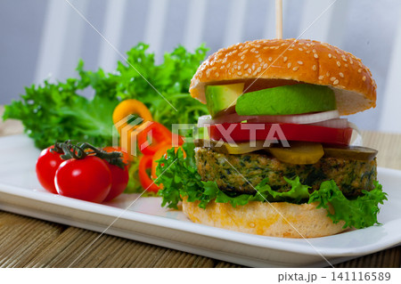 Veggie burger with falafel and vegetables Veggie burger with falafel and vegetables 141116589