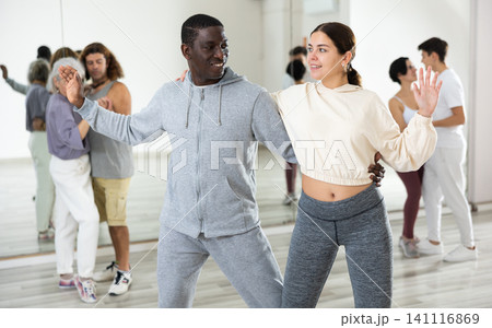 Dancing positive couples learning salsa Dancing positive couples learning salsa 141116869